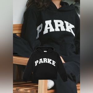 Parke Varsity Hoodie Sweatshirt. Size S/M and in the color  Black + White.